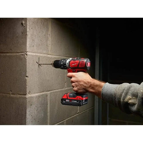 Heavy Duty Cordless Half Inch Hammer Drill Driver Kit Operating As A No Hassle Workhorse with a person using it on concrete.