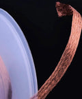 5 Ft Pro-Grade Copper Desoldering Wick With No Clean Design And 280C Melting Point unraveling, showing braided texture and spool