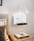 Bedside Sconce With Wireless Charging Pad And USB C And USB A Ports, 3 Adjustable Color Temperatures LED Reading Light displayed by bed