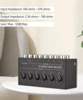 Compact Six Channel Passive Stereo Mixer With RCA Inputs and Two Channel Output on table, black metal design, no battery needed.