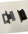 Six pack self closing cabinet hinges on white wood surface