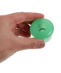 Holding a single light green PU Toe Stop Replacement Pair For Quad Skates With PU Brake Pads No Fuss Install.