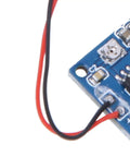 Close-up of Piezoelectric Vibration Sensor Module with Adjustable Sensitivity and 5V DC Analog Output for Tapping and Vibration Detection.