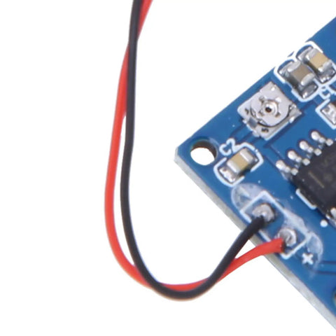 Close-up of Piezoelectric Vibration Sensor Module with Adjustable Sensitivity and 5V DC Analog Output for Tapping and Vibration Detection.