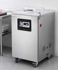 Heavy Duty Commercial Chamber Vacuum Sealer Featuring Dual 20 Inch Seal Bars For Restaurant Butcher Shop Kitchen Use Electric Floor Packing Station in stainless steel with clear lid.