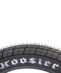 Close-up of 130/80-19 FT30 dirt bike front tube type tire for flat track racing, Hoosier branding visible on sidewall.