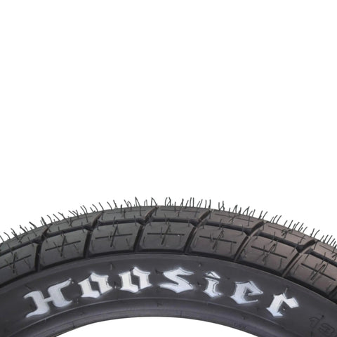 Close-up of 130/80-19 FT30 dirt bike front tube type tire for flat track racing, Hoosier branding visible on sidewall.