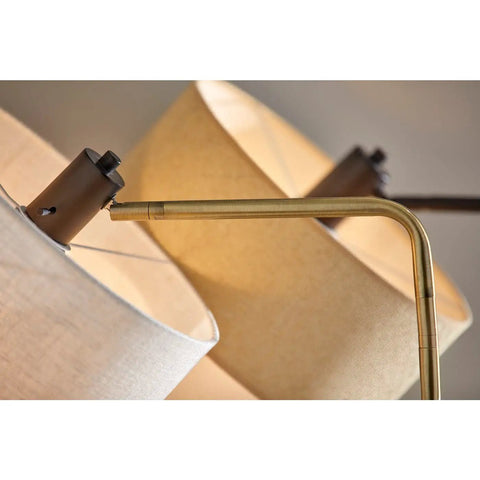 Close-up of Jacob Table Lamp With Swing Arm, 24 To 25.5 Inch Tall, showing antique bronze finish and natural woven drum shade.