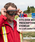 Man wearing red uniform fitting Odyssey II Wildland Fire Goggles With Anti Fog And Anti Scratch Eye Protection For Men And Women Fits Over Glasses FR Strap ANSI Z87.1 Heat Resistant Up To 350 Degrees F Durable Firefighting Safety Goggles over glasses outdoors
