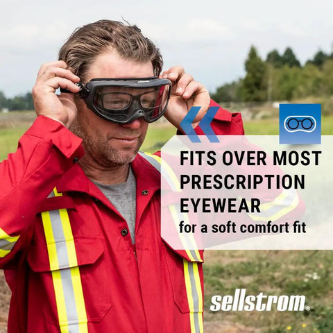 Man wearing red uniform fitting Odyssey II Wildland Fire Goggles With Anti Fog And Anti Scratch Eye Protection For Men And Women Fits Over Glasses FR Strap ANSI Z87.1 Heat Resistant Up To 350 Degrees F Durable Firefighting Safety Goggles over glasses outdoors