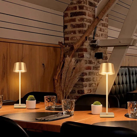 Cordless Table Lamp With Dimmable And Rechargeable Battery on dining table, gold lampshade, ideal for indoor and outdoor use.