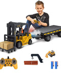 Child playing with Remote Control Forklift With Flatbed Truck 11 Channel RC Crane Toy With Realistic Lights And Sound Lit 2 In 1 Lift Fork And Hook