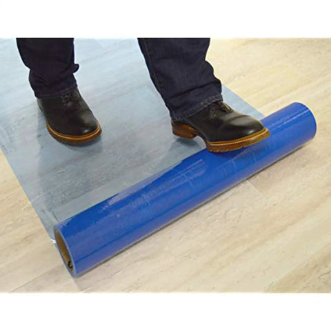 Person stepping on Hard Surface Protection Film 24 Inch By 200 Foot Floor Shield With Self Adhesive Backing And Easy Install On Floor