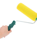 Texture Pattern Paint Roller Sponge Brush For Walls Ceilings And Home Painting Is A Total Gamechanger, yellow sponge roller in hand.