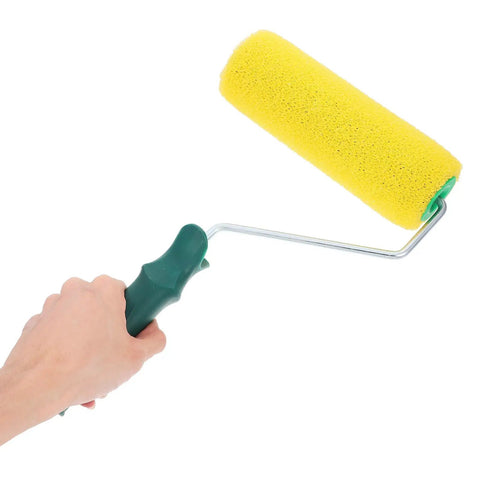 Texture Pattern Paint Roller Sponge Brush For Walls Ceilings And Home Painting Is A Total Gamechanger, yellow sponge roller in hand.