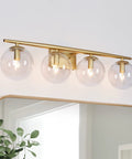 Gold Vanity Light Fixture for Bathroom Over Mirror with Four Lights, Clear Globe Glass Shades, Modern Glam Bath Lighting