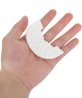 Hand holding a white Premium Rubber Sole Protector for Sneakers and Boots with 4mm Anti Scuff Heel Pads.