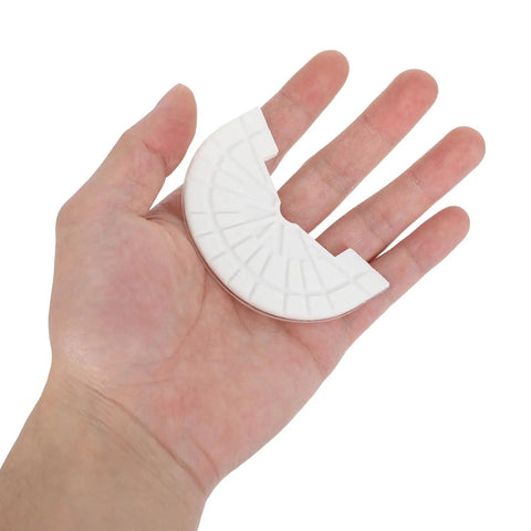 Tough As Nails Shoe Heel Pads 4Mm Thick Rubber Non Skid Adhesive Repair Kit in hand showing size and texture.