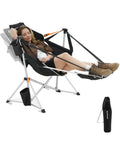 Person relaxing in Hammock Chair With Footrest For Adults Up To 400 Lbs Heavy Duty Folding Outdoor Rocker With Cup Holder and Pillow
