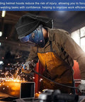 Welder wearing a black Welding Helmet Cover Pro Grade Extended Head Cover With Press Fit Seal Full Protection Cotton Welding Head Cover For Most Helmets Easy Install Weld Hood Accessory Black, sparks flying.