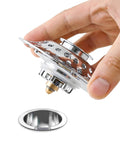 Lightweight Stopper, Bathtub Drain Plug for Various Drain in hand, showcasing shiny metal design and drain opening.