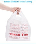 Hand holding White Thank You Bags Case Of 1000, 11.5 By 6 By 21 Inches, 0.48 Mil HDPE Plastic, Standard Grocery Size