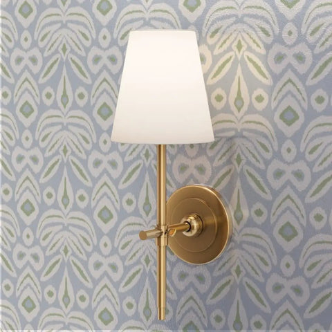 Wall sconce lamp mounted on soft blue and green wallpaper featuring Upgrade Your Interior Game With This Rad Boho Ikat Soft Silver Metallic Wallpaper Featuring A Chic Fibrous Finish That Adds Major Bling To Any Walls Paste The Wall Friendly Eco Safe Class A Fire Rated Wall Covering Crafted In The Usa For Top Tier Style.
