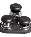 Big Time 58mm Espresso Accessories Kit Featuring Slick Stirrer Distribution Tool And Spring Loaded Distributor Leveler, black and chrome tools on display.