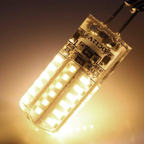 Close-up of G4 LED Bulbs 10 Pack, BiPin Base 3W 12V AC DC Landscape Light Replacement, Warm White 3000K, glowing with warm light