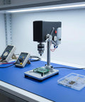 ShengQuanHao Mini Bench Drill Press With Precision Chuck for drilling circuit boards on a blue work surface.