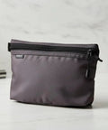 On The Go Dopp Kit Toiletry Bag For Men Water Repellent Nylon Travel Pouch on bathroom counter