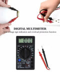 Pocket Size Digital Multimeter With LCD Auto Range for Voltage AC Current Resistance testing, hands using probes on white background