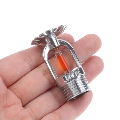 Top Shelf 57C Hella Efficient Fire Sprinkler Head Built Solid For Compact Concealed in hand, showing copper alloy frame and quick response.