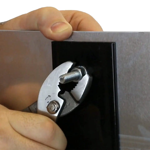 Using pliers to secure bolt on K Kit Sign Attachment Kit for Posts with Heavy Duty U Channel and Galvanized Posts