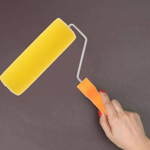 Textured Sponge Paint Roller For Wall Painting With Ergonomic Handle held in hand, showcasing yellow sponge material and ergonomic design.