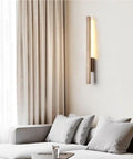 Linear Wall Sconce Wood Grain Strip Wall Light Slim Vertical Lamp Modern Minimalist Fixture Warm Lighting for Bedroom Living Room Hallway Background Wall Decor on a wall next to a couch with neutral decor.