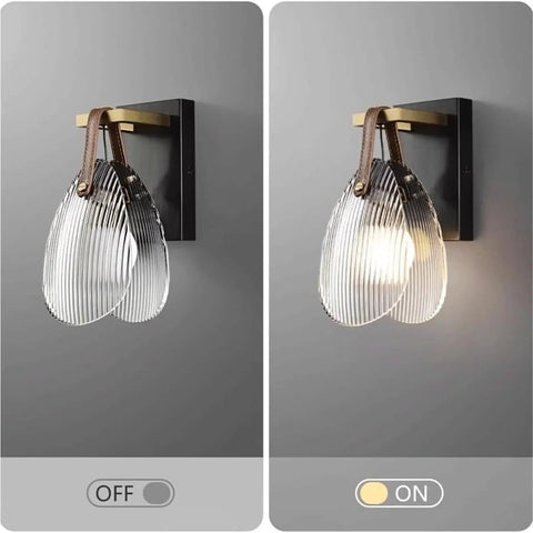 Fluted Glass Wall Sconce Ribbed Shade Leather Strap Brass Finish Metal Light 10 Inch Height in OFF and ON states mounted to wall.