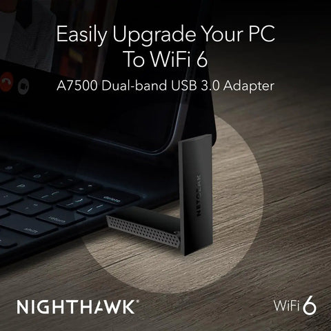 Nighthawk WiFi 6 USB 3.0 Adapter A7500 AX1800 connected to laptop for enhanced WiFi connectivity on wooden desk.