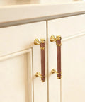 10 Pack 5 Inch Cabinet Pulls In Wood And Gold Finish installed on a kitchen cabinet, round wood handles with 128mm center to center