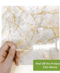Hand peeling film from Peel And Stick Brown Marble Backsplash Tiles 50 Piece Set 5.9 Inch Square Self Adhesive PVC Wall Tile.
