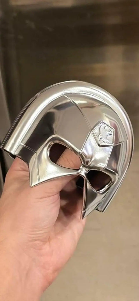 Rad Chrome Paint Pint Kit Featuring 2K Basecoat And 1K Topcoat delivers a shiny chrome mask held in hand.