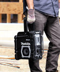 18V LXT Cordless Bluetooth Job Site Radio with FM stereo being held by person on construction site
