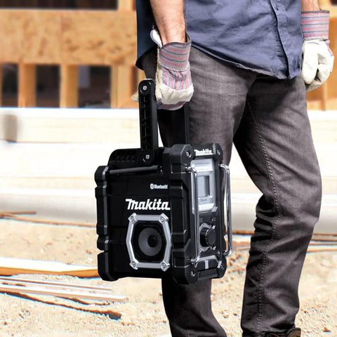 18V LXT Cordless Bluetooth Job Site Radio with FM stereo being held by person on construction site