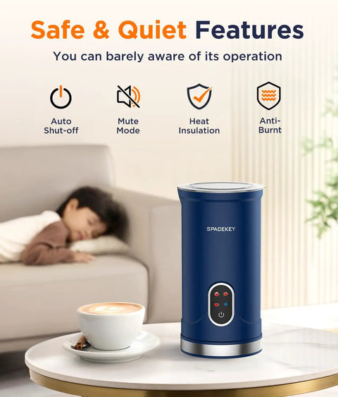 Blue No Fuss Electric Automatic Milk Frother With Quiet Mute Mode 300ml Capacity Overheat Protection on a table next to a cappuccino