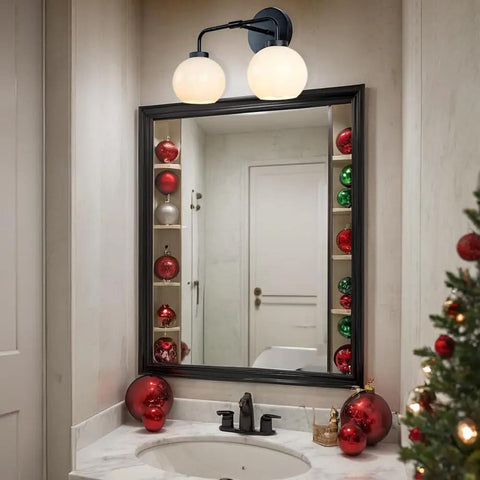 Double Glass Globe Wall Sconce, 17 Inch Sleek Modern Design In Matte Black above vanity mirror