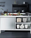 Heavy Duty Stainless Steel Prep Workbench With Cabinet Sliding Doors And Splatter Guard Backsplash Commercial Grade Metal Kitchen Workhorse Built Like A Tank Featuring Solid Rubber Feet with ingredients.