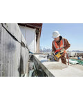 Worker using Flexvolt 9 Inch Diamond Cutting Wheel For Masonry And Concrete With Seven Eighths Inch Arbor 6600 Max RPM on concrete