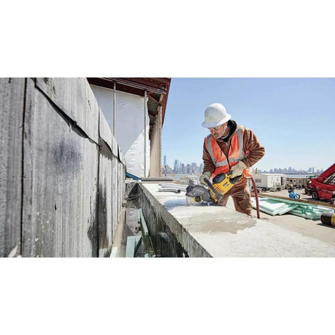 Worker using Flexvolt 9 Inch Diamond Cutting Wheel For Masonry And Concrete With Seven Eighths Inch Arbor 6600 Max RPM on concrete