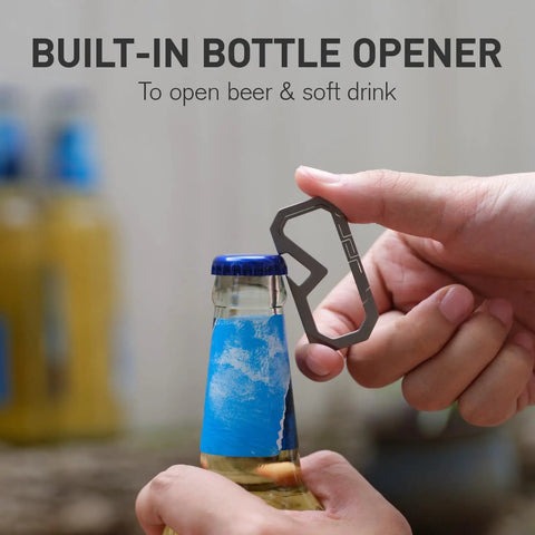 Badass Titanium Keychain Carabiner Multitool With Bottle Opener being used on a glass bottle cap, showcasing its utility and design.