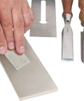 Hand using Pro Grade Diamond Whetstone Honing And Polishing Kit For Sharpening Router Bits Chisels Knives And Planer Blades